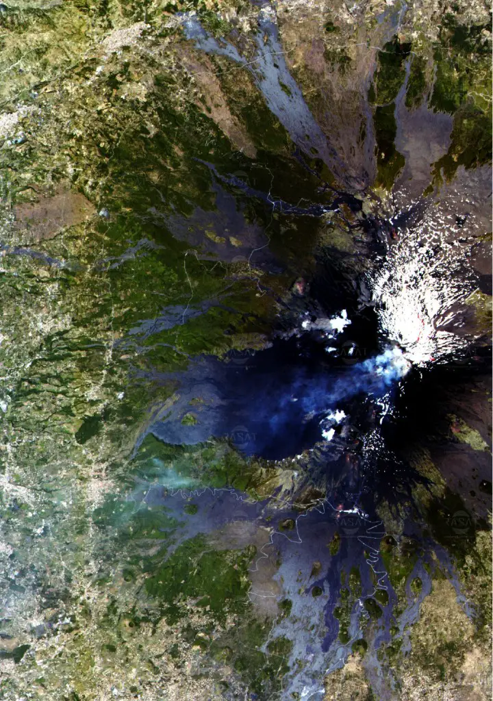Italy’s volcano, Mount Etna, sends up plumes of smoke in this image captured on June 7, 2012, by the Turkish research satellite, RASAT. Image Credit: TÜBITAK.