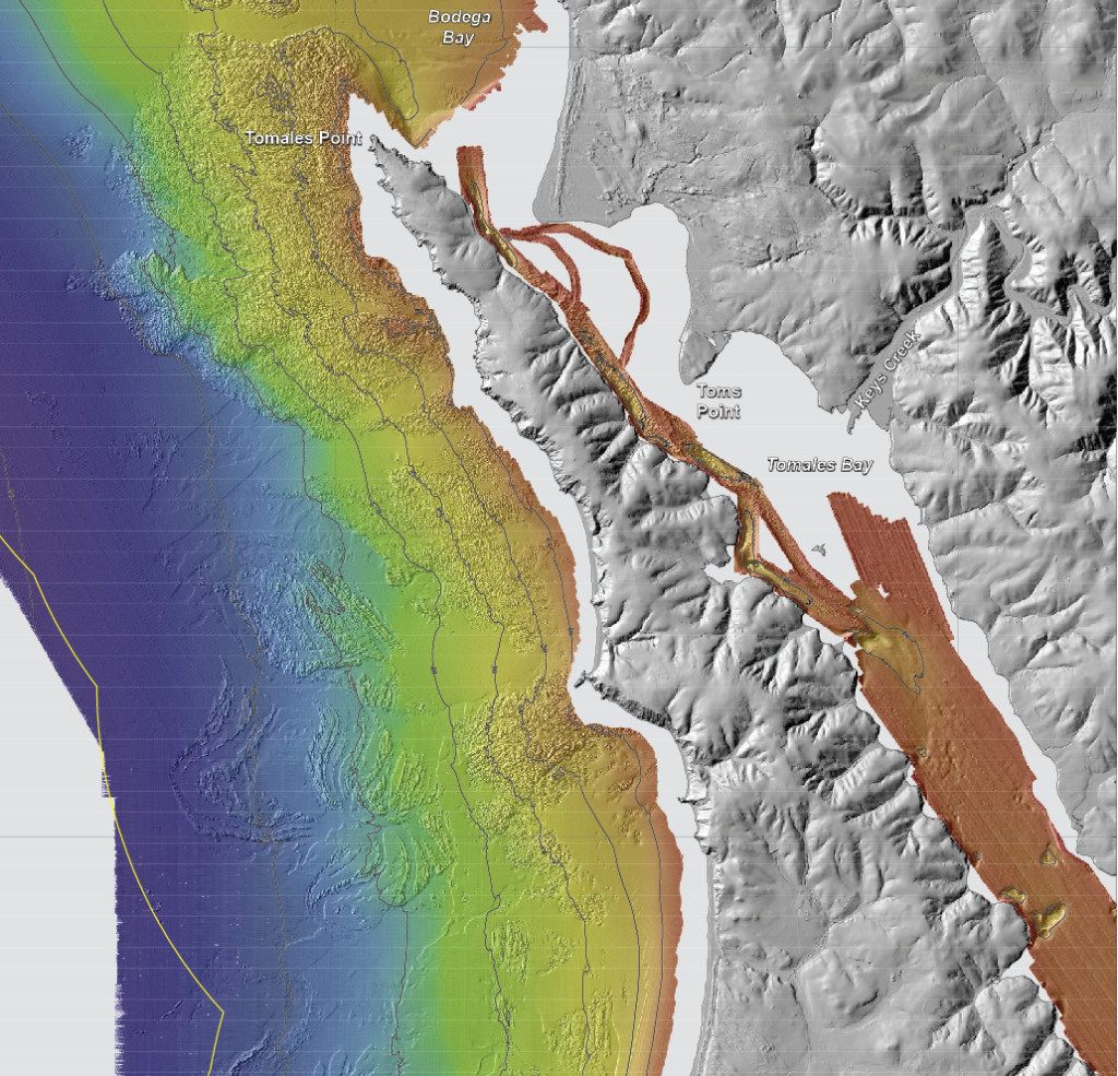 Bathymetry bounding Tomales Point. Rugged and massive granite outcrops extend offshore from Tomales Point to water depths of as much as 60 meters. Offshore sedimentary rock outcrops (lower left part of image) form distinctive “ribs” on the seafloor and have a notably different appearance. There is minimal sediment on this part of the California shelf because the watersheds draining the west flank of Tomales Point are very small and because Tomales Point and Tomales Bay block sediment transport from the north. Rocky-shelf outcrops and rubble are excellent habitats for rockfish and lingcod, recreationally and commercially important species. Tomales Bay, approximately 20-km long and 1- to 2-km wide, formed along a submerged portion of the San Andreas Fault (very shallow water depths preclude collection of high-resolution bathymetric data at the mouth of Tomales Bay).
