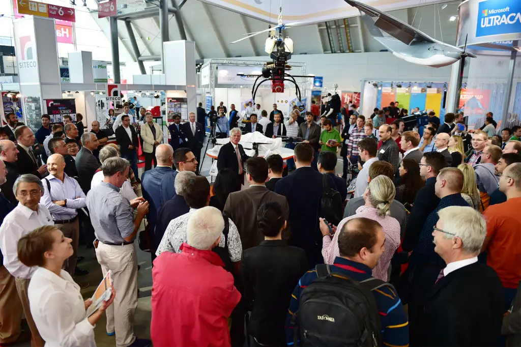 Attracting a lot of attention: Dr. Riegl, CEO, unveiling the new RIEGL BathyCopter at the RIEGL Intergeo booth in Stuttgart