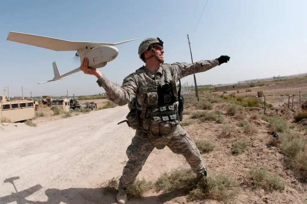 091009-A-3108M-009 U.S. Army 1st Lt. Steven Rose launches an RQ-11 Raven unmanned aerial vehicle near a new highway bridge project along the Euphrates River north of Al Taqqadum, Iraq, on Oct. 9, 2009. Rose is assigned to Charlie Company, 1st Battalion, 504th Parachute Infantry Regiment, 1st Brigade Combat Team, 82nd Airborne Division which is assisting Iraqi police in providing security for the work site. DoD photo by Spc. Michael J. MacLeod, U.S. Army. (Released)