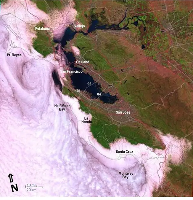 This Landsat image of May 22, 1991 shows the marine stratus and stratocumulus cloud layer that moved into the San Francisco Bay-Delta and Monterey Bay. Several cloud patterns can be seen in this image: the eddy-like spiral to the west of the Golden Gate, the darker linear cloud feature that parallels the coast down to Monterey Bay, and fog funneling from Monterey Bay inland.